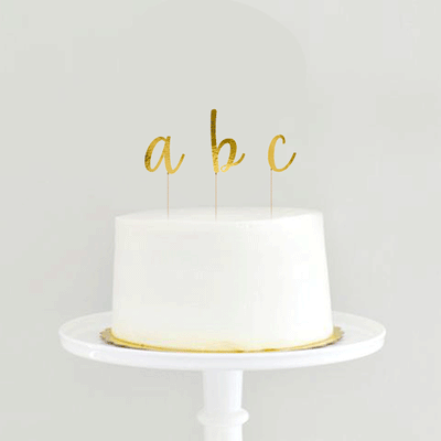 Golden alphabet cake topper